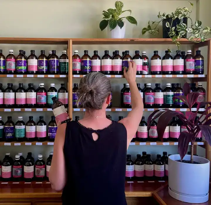 A naturopath selecting herbs to compound a formula