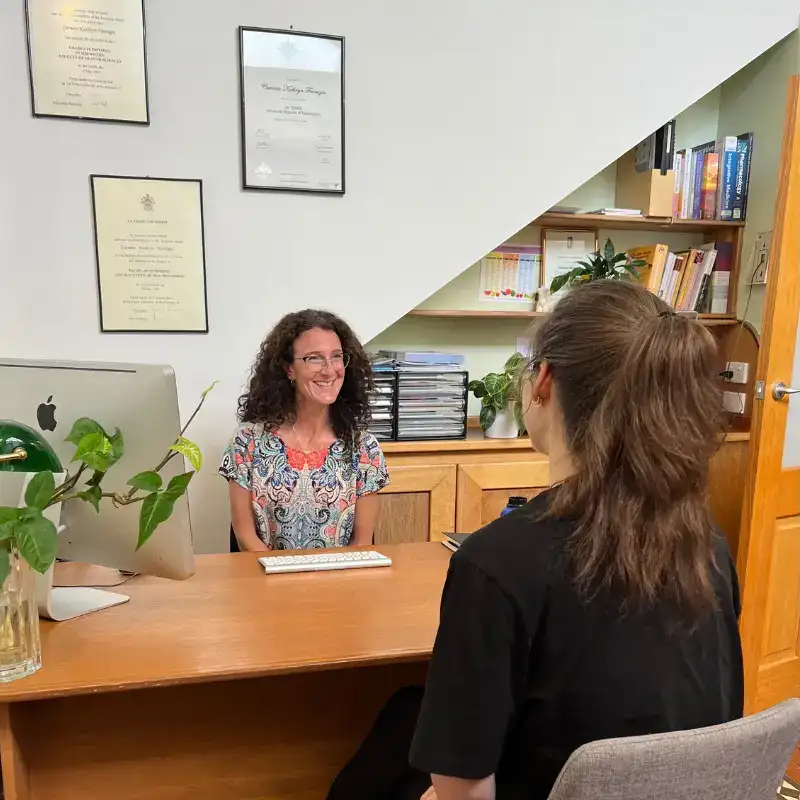 A naturopath and client during a consultation